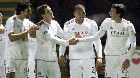 The Aberdeen players celebrate Joe Shaughnessy's (right) goal