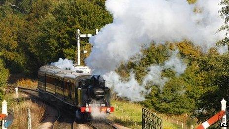 Steam engine carries Bernard Holden's coffin along the Bluebell Railway