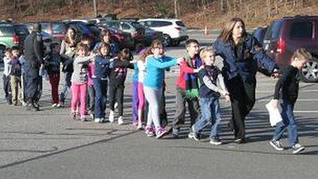 Children leave Sandy Hook School in Newtoen, Connecticut 14 December 2012