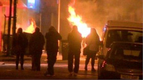 Protestors block roads with burning rubbish bins and threw fireworks and bricks at police