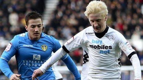 Will Hughes (right) holds off Ross McCormack of Leeds