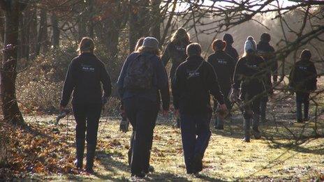 Children walk back to carpark through woods