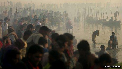 Hindu pilgrims gather to bathe at sunrise at the ritual bathing site at Sangam, the confluence of the Ganges, Yamuna and mythical Saraswati rivers during the Ardh Kumbh Mela festival (Half Pitcher festival) January 23, 2007