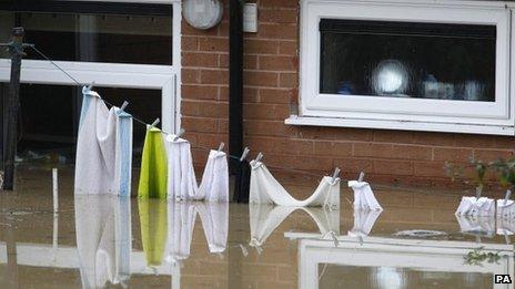 Washing line under water following flooding at St Asaph, Denbighshire, in November 2012