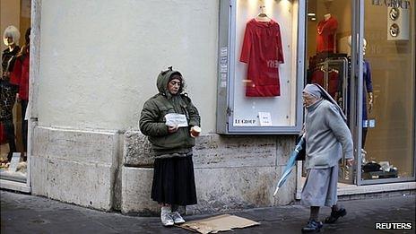 Nun passing by a beggar in Rome, 10 Dec 12