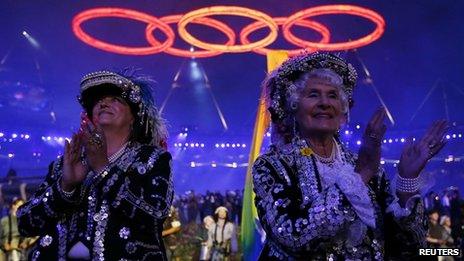 Performers clap during the opening ceremony of the London 2012 Olympic Games