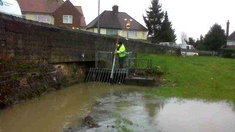 Environment Agency staff clearing out trash near Northampton