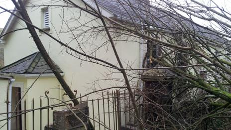 Trees fallen against the vestry of Pantteg Chapel in Ystylafera after the landslip