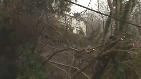 A house has been also left on the edge of a drop, where the land in front of it has slipped away