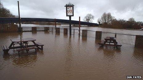 Floodwater in front of the new defences in Upton-upon-Severn