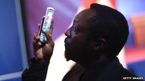 Will.i.am using phone