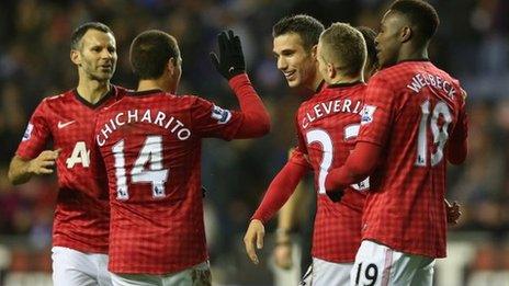 Man Utd players celebrate their victory over Wigan