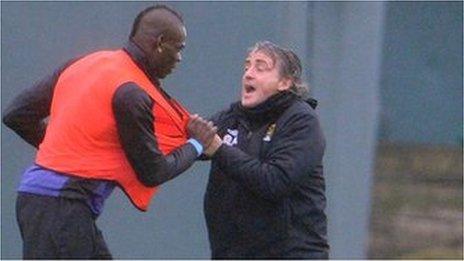 Manchester City striker Mario Balotelli and manager Roberto Mancini