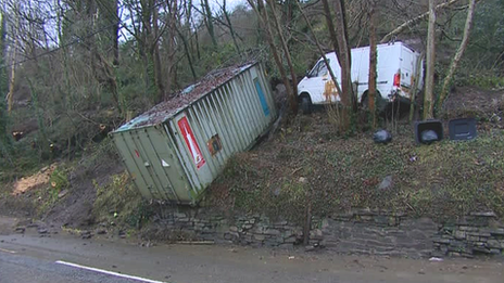 Storage container and van caught in landslide