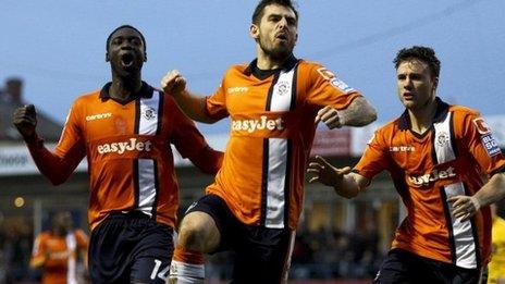 Luton players celebrate scoring the opening goal against Wolves