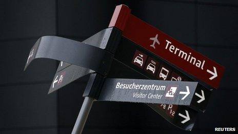 A damaged sign is pictured at the construction site of the future Berlin Brandenburg international airport