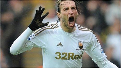 Michu celebrates after scoring against Arsenal