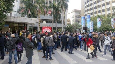 Demonstrators gather outside the headquarters of Southern Weekly newspaper in Guangzhou, Guangdong province, 7 January 2013