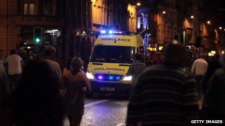 Ambulance and Saturday night revellers in Cardiff