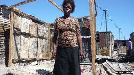 Zukiswa Gala in the ruins of her family's home in Khayelitsha