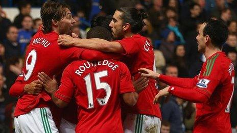 Swansea celebrate a goal against Chelsea