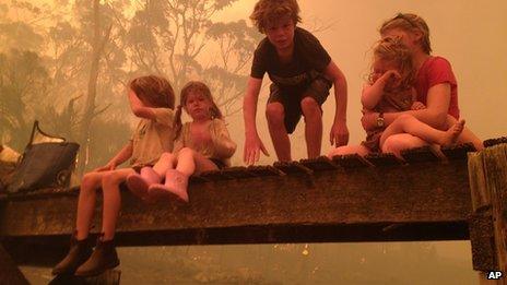 Photo of the Walker siblings as they prepare to enter the water to seek shelter under a jetty (4 January 2013)