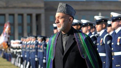 Afghan President Hamid Karzai reviews an honour guard at the Pentagon before his meeting with US Secretary of Defense Leon Panetta 10 January 2013