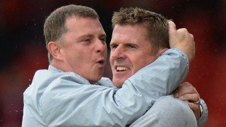 Coventry manager Mark Robins celebrates with assistant Steve Taylor