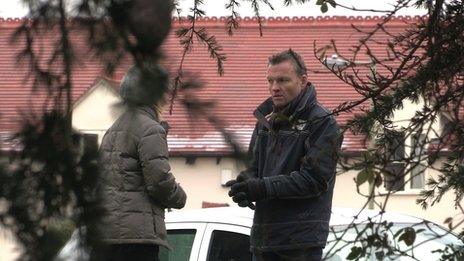 Chris Geiger (right) and his TV "wife" prepare for the consultation