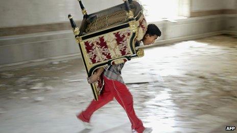 Furniture being looted from presidential palace