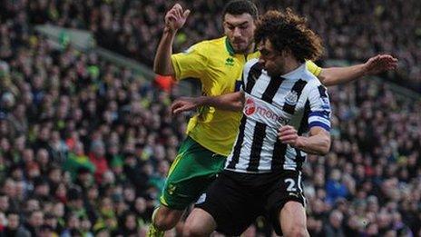 Fabricio Coloccini (middle) tacjkles Norwich midfielder Robert Snodgrass