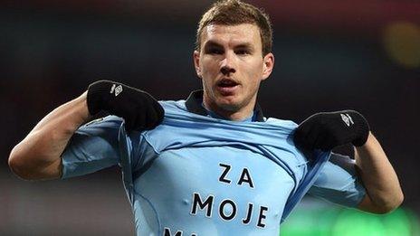 Edin Dzeko celebrates after scoring Manchester City's second goal