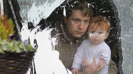 Michael Bower with his daughter after the attack on his house