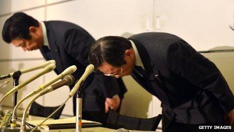 All Nippon Airways executive Hiroyuki Ito (left) nd vice-president Osamu Shinobe bow their heads