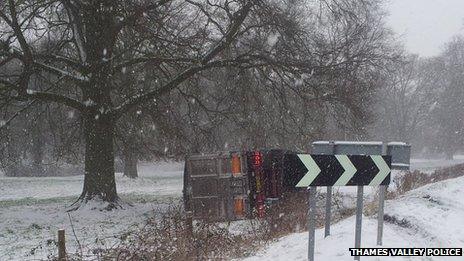 Truck on side in snow by B4030 in Middleton Stoney