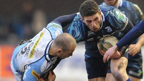 Mark Jennings takes the aerial approach in his attempt to pull down Blues wing Alex Cuthbert