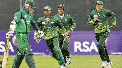 Pakistan players celebrate after taking the wicket of Ed Joyce at Stormont in 2011