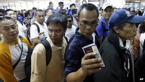 Filipinos evacuated from the crisis-hit Algerian gas plant arrive back home at Manila international airport