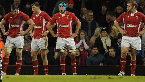 Wales players are dejected after defeat to Australia