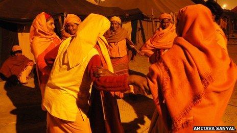 Group of Juna Sanyasini Akhara dancing in a ring