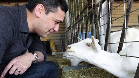 Dr Adam Rutherford with a goat that can produce silk