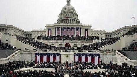 President Barack Obama waves after his Inaugural speech at the ceremonial swearing-in on the West Front of the US Capitol