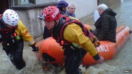 RNLI flood rescue team helping people in St Asaph