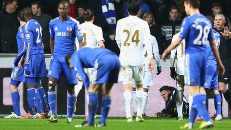 Chelsea and Swansea players react after the incident between Eden Hazard and the ball boy