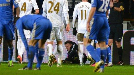 Ball boy lies on the ground after the incident