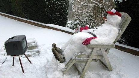 Snowman watching TV