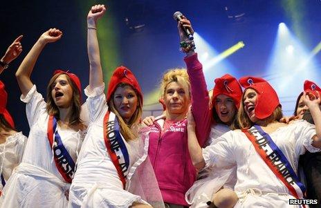 French TV host Virginie Merle (C), also known as "Frigide Barjot", demonstrates against the gay marriage in Paris, 13 January