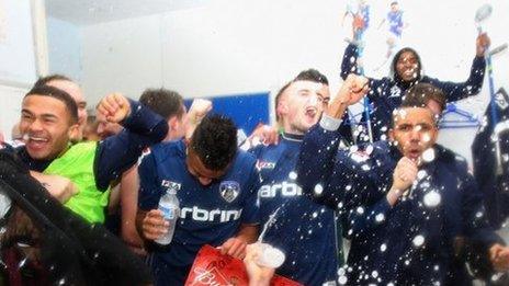 Oldham's players celebrate their win over Liverpool which earned them a tie against Everton