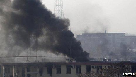 Smoke rises from the Kabul traffic police headquarters during an insurgents' attack on Monday 21 January 2013