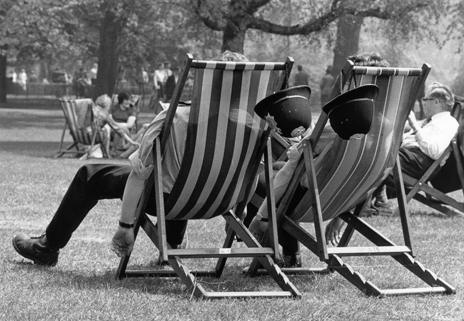 Two beat officers rest in deckchairs, 1976